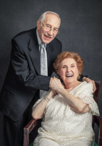 An elderly woman holds her boyfriend's hand during a portrait session with Janel Lee Photography in Cincinnati