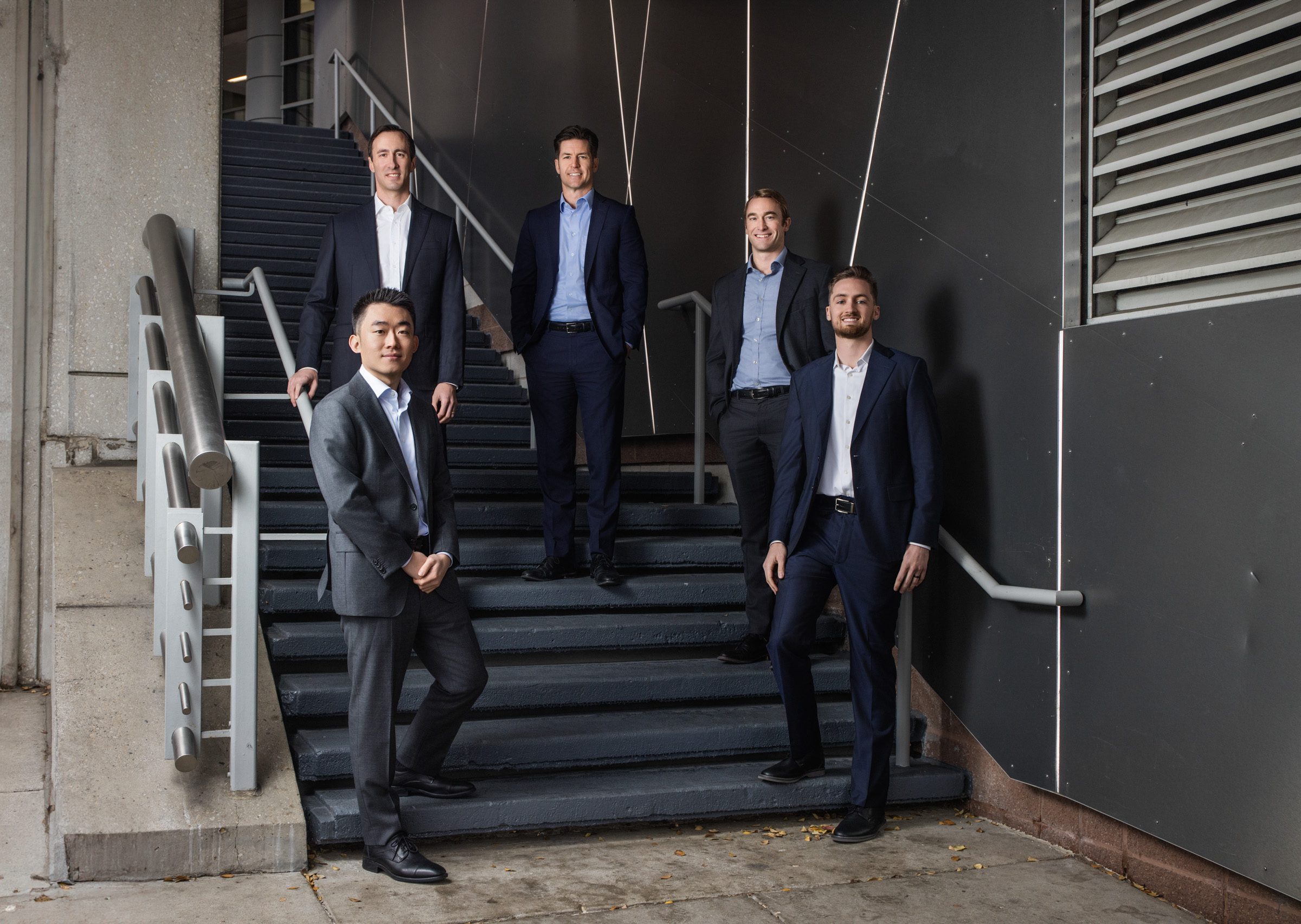Executive team portrait of wealth management firm in Cincinnati Ohio with financial advisors in a modern corporate environment